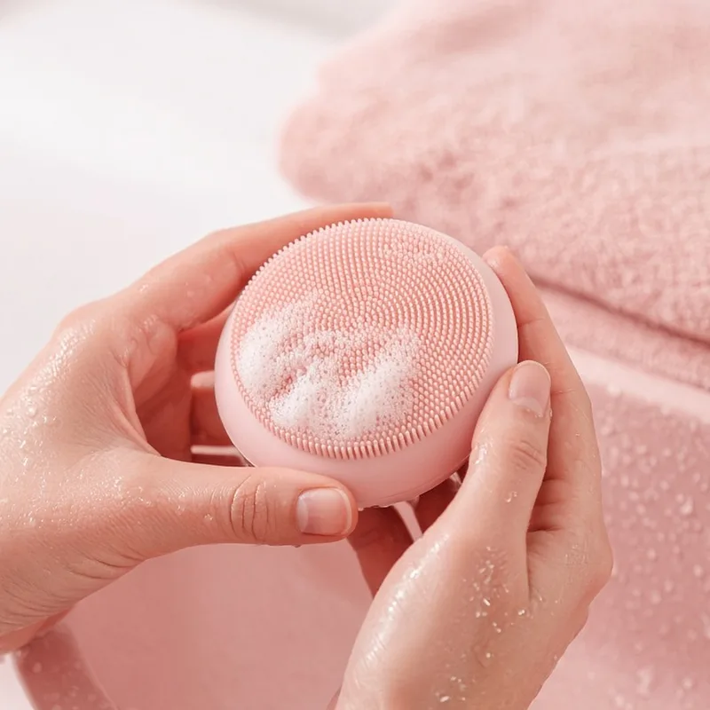 Illustration of a round silicone facial cleansing brush on a vanity, standing in for the PRITECH brush